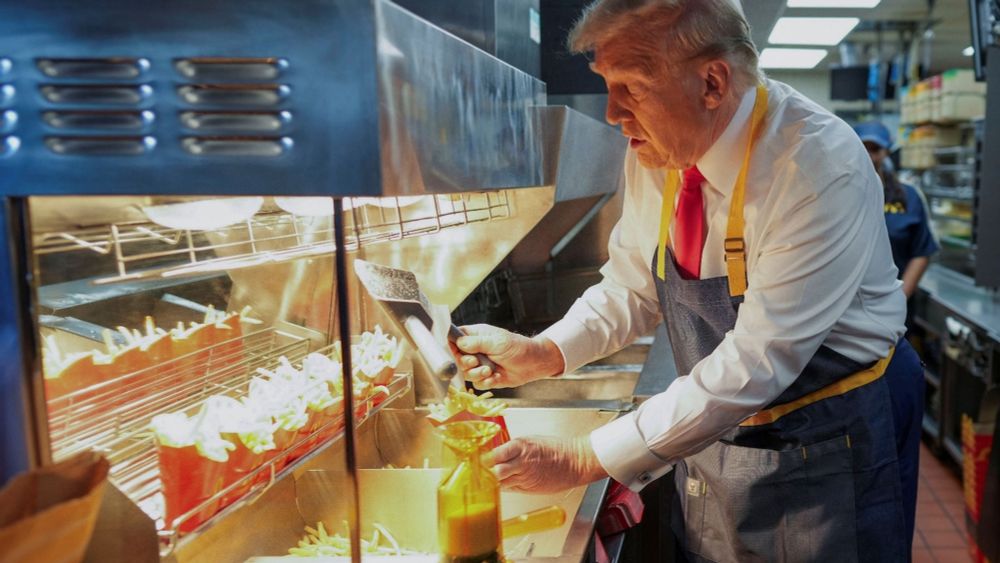 Trump serves McDonald’s fries to supporters in stage-managed campaign stop