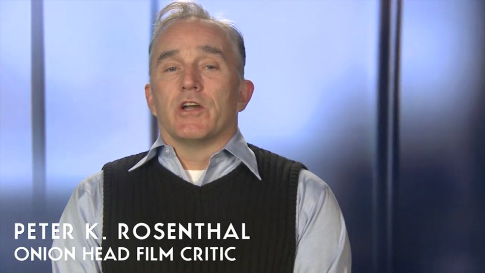 The Onion film critic, Peter K. Rosenthal (Ron E. Rains) 