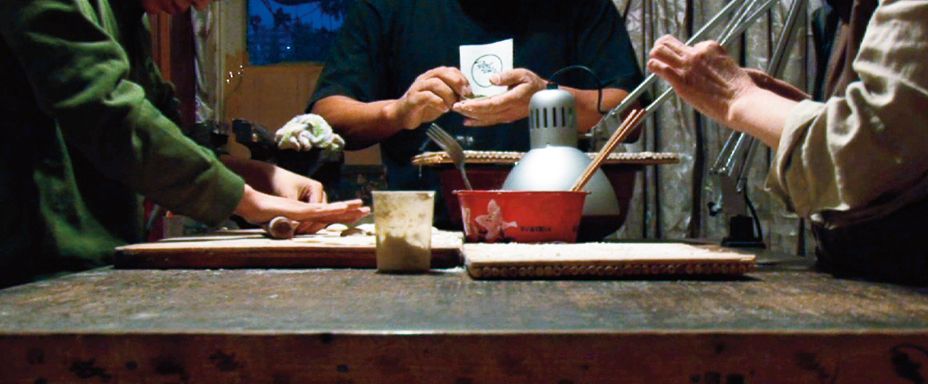 The hands of a family making dumplings at the kitchen table. Just making dumplings for 90 minutes. The camera moves eight times. That’s it!