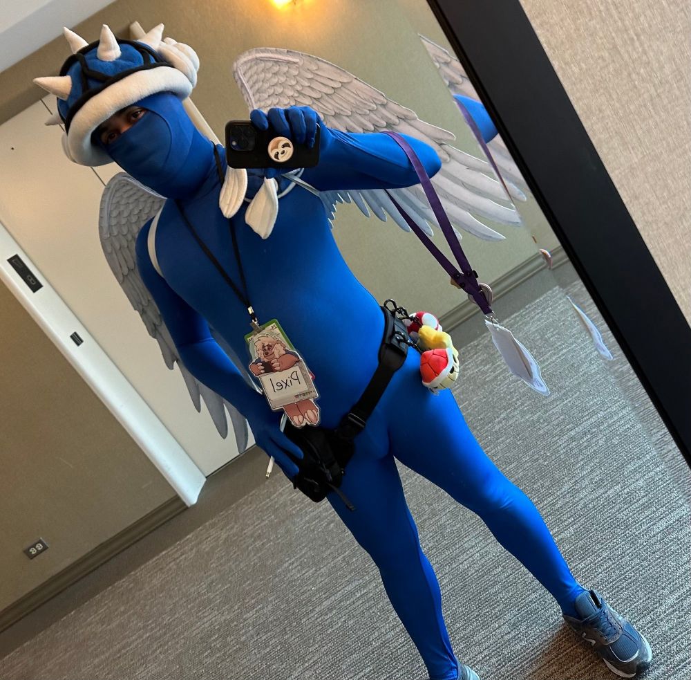 Blue Shell cosplayer taking a selfie in front of a mirror