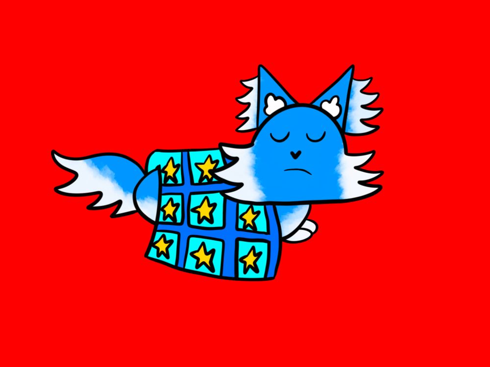 My sona Sky/Ck, a blue cat with cloudy white ear tufts, face fluff, chest, belly, paws, and underside of their tail, sleeping under a blue blanket with turquoise patches that have yellow stars in them!