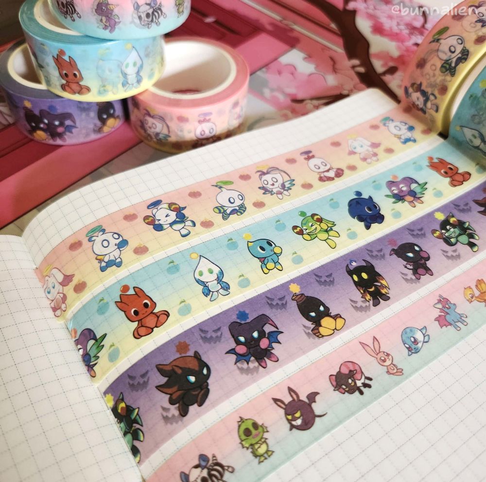photo of washi tape on grid notebook paper. designs feature hero, neutral, and dark chao, as well as the small animals from Sonic Adventure 2!