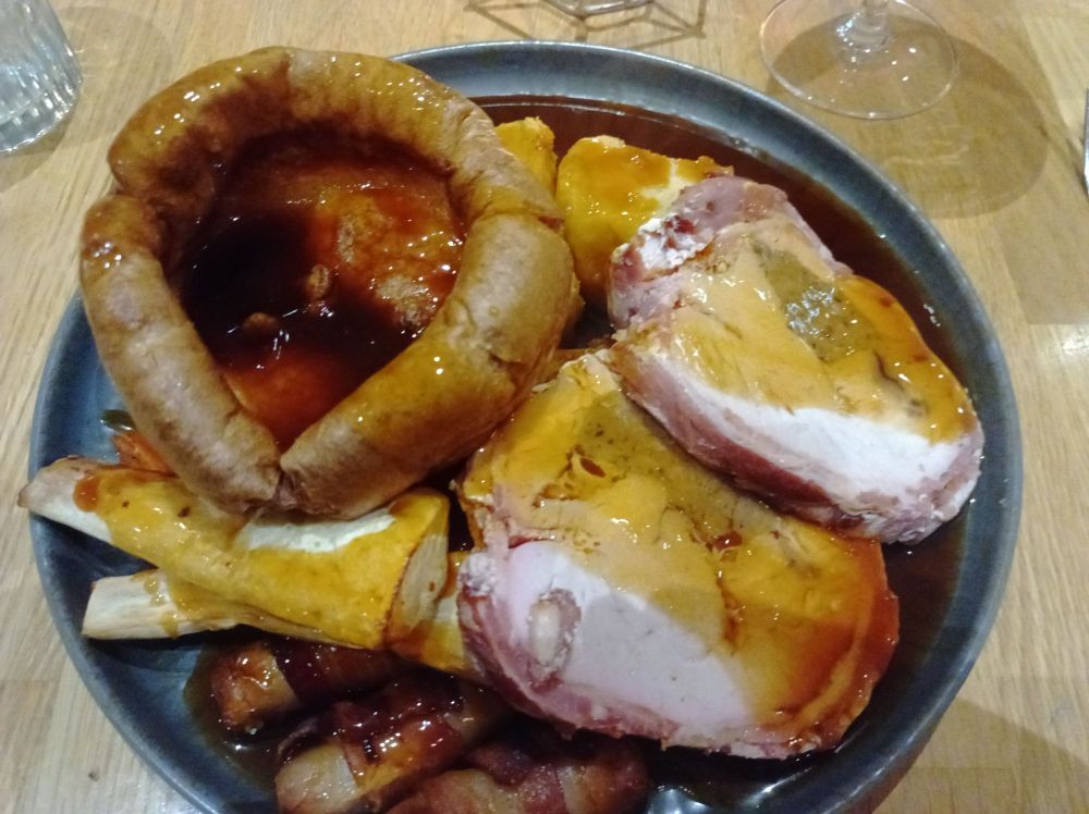 Turkey with stuffing inside. A giant Yorkshire pudding. Pigs in blankets and veg. Parsnips too.