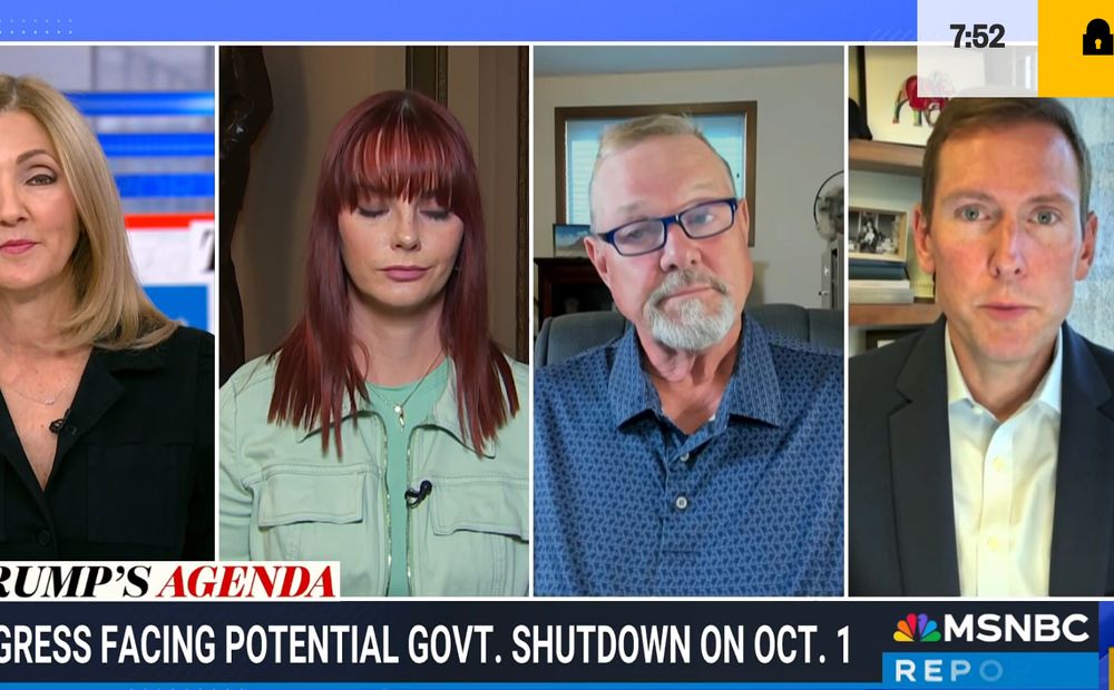 Screenshot from MSNBC showing Jon Tester second from the right. His brush cut, flat-top haircut is a bit grown out, he has a van dyke beard, he's wearing glasses and seems to have lost a lot of weight