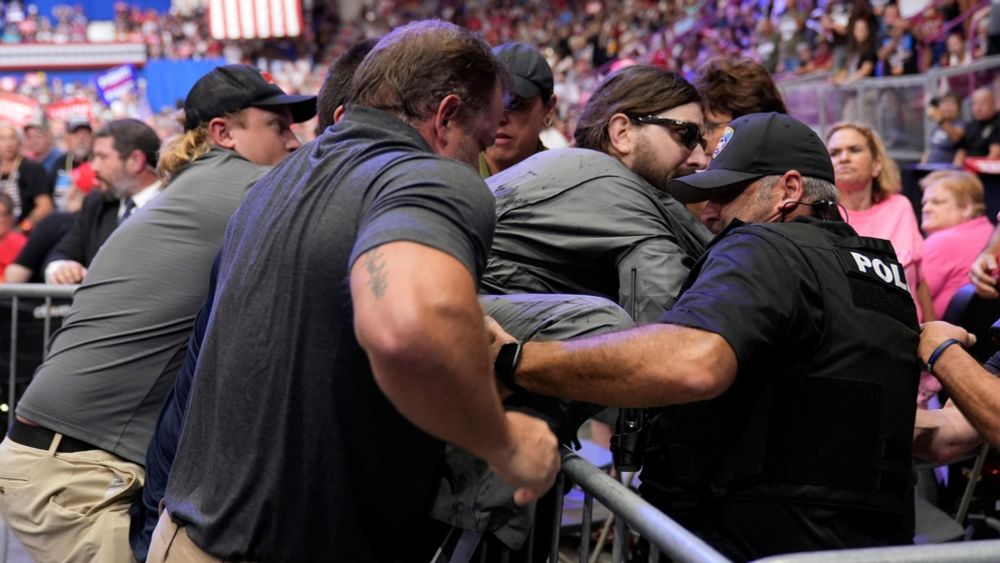 Police says a man will face charges after storming into the press area at a Trump rally