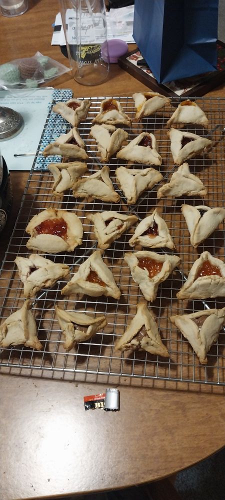 More hamentaschen with strawberry, apricot, Nutella, and cherry filling. This batch has several crumbled and broken pieces.