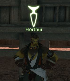 A Horthur male stands around in a miner's outfit.