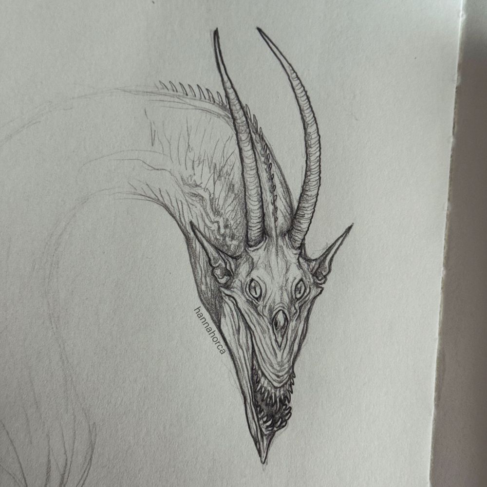 Pencil drawing of a dragon with long horns and sharp teeth 