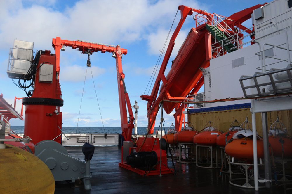 View of the back deck of the research vessel Maria S. Merian, showing the A-frame and flotation for moorings.