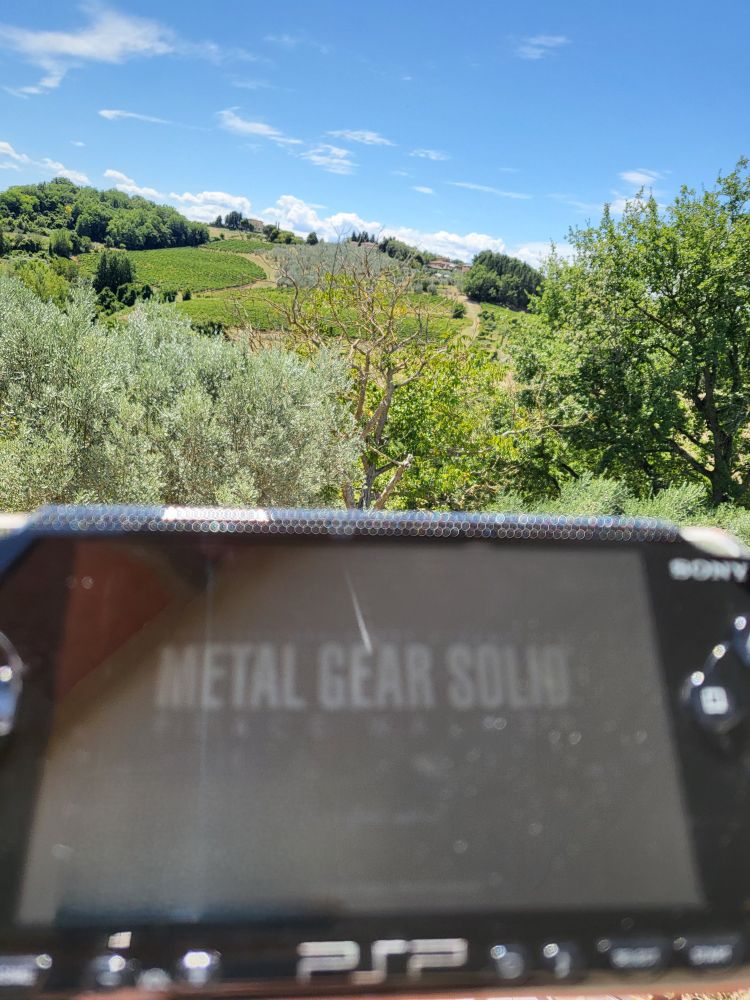 a picture of metal gear solid peace walker being played in tuscany