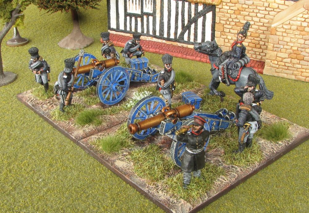 The mounted figure is the Regimental officer wearing bicorn and open Uberock from the Prussian Line Uhlans Advancing range. The idea is that the uhlan officer has just arrived on the scene with an urgent message for the battery commander who is currently concentrating on what is to be seen through his telescope. The uhlan officer and several of the gun crew are trying to gain the battery commander’s attention but sadly this gentleman has been around 12 pounder guns too long with the result that he is a little hard of hearing!