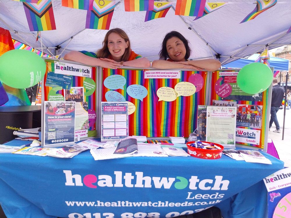 Gemma and Tatum behind the Healthwatch Leeds stall.