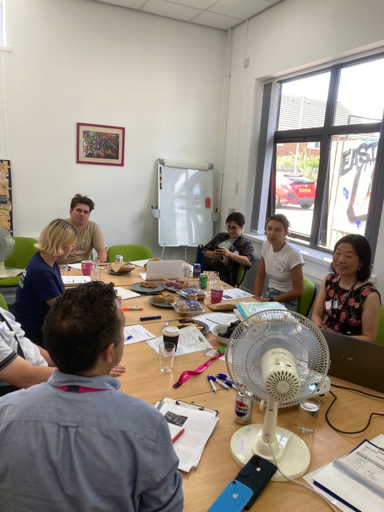A room with staff and volunteers taking part in the training.