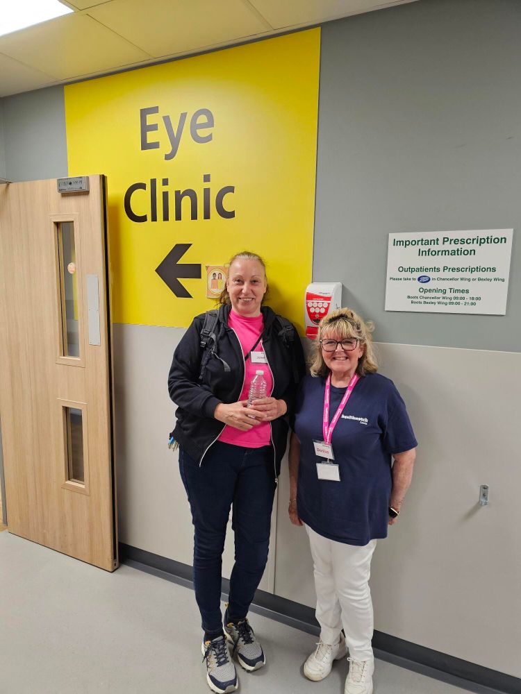 Healthwatch Leeds volunteers stood outside the Leeds Teaching Hospitals NHS Trust Eye Clinic