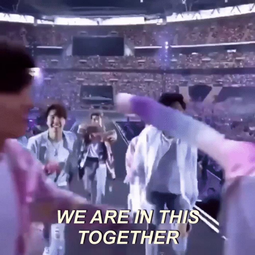 a group of people are dancing in a stadium with the words we are in this together written on the bottom