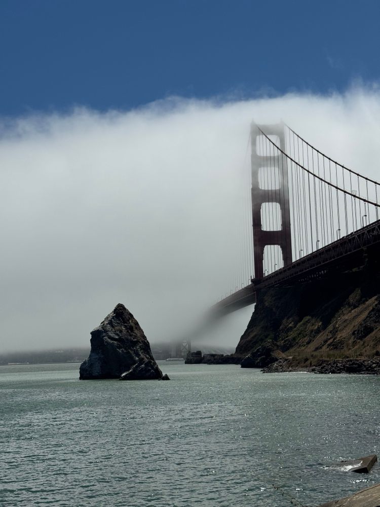 Golden Gate Bridge being eaten by fog. 