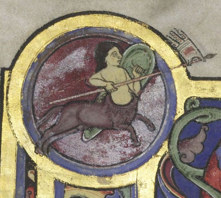 A detail of a full page illumination: a golden circle surrounds a galloping centaur while holding a spear with a frindged flag and a green shield 

Decoration from the Bury Bible, now in the Parker Library as Corpus Christi College, Cambridge MS 2i, fol. 1v