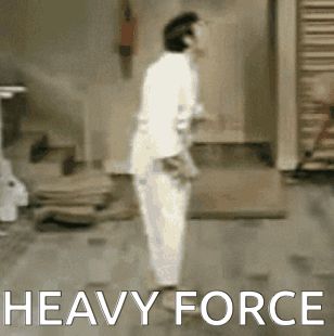 A large (obviously fake) weight drops on a man in a white gym outfit. It is a "heavy force". 
