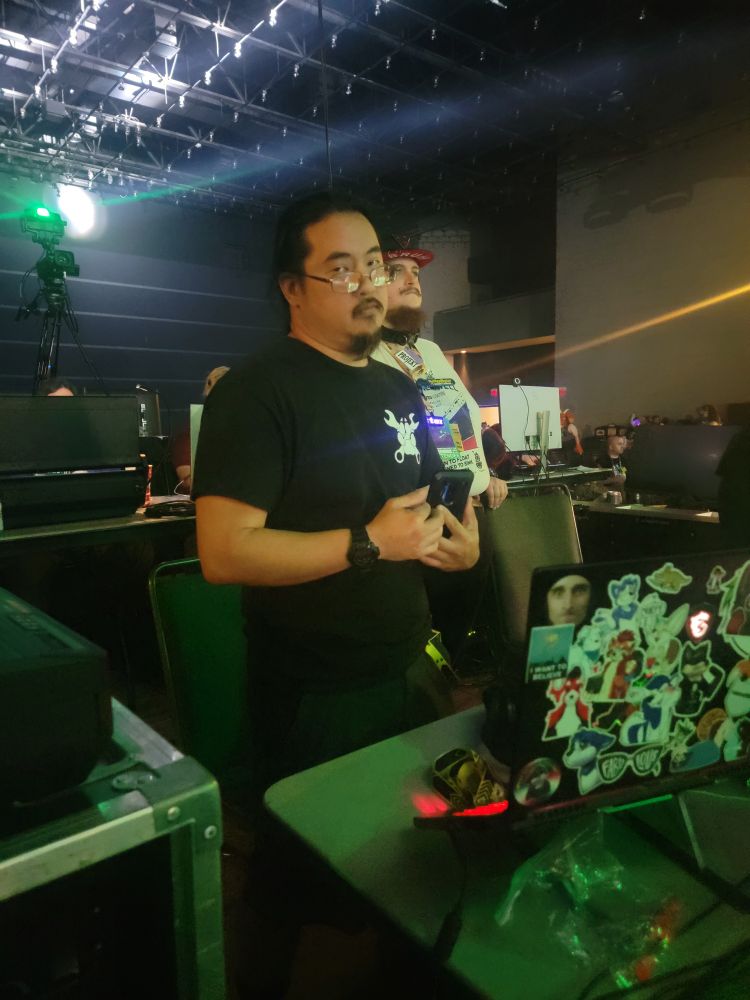 Raven at Anthrocon 2025 at the Saturday night dance doing AV duty!