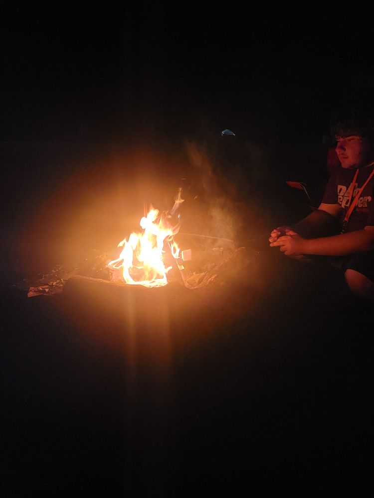 Making smores at Noctfurnal as music plays in the background 