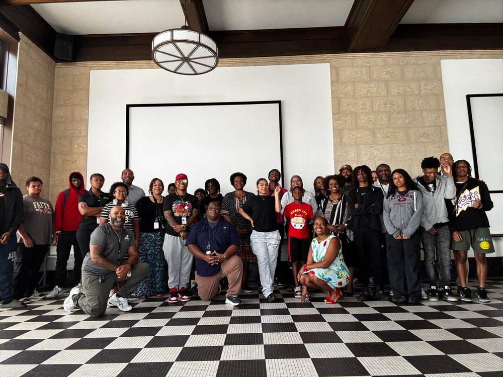 Group photo of Durham County staff and Project BUILD participants inside the Justice Resources Center.