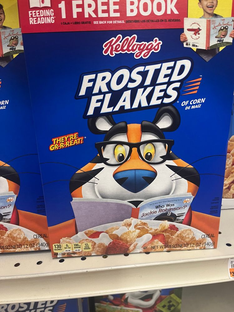 box of Frosted Flakes featuring Tony the Tiger wearing reading glasses.