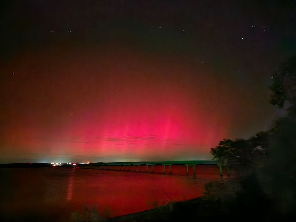 Photo of the Northern lights over a lake in Texas
