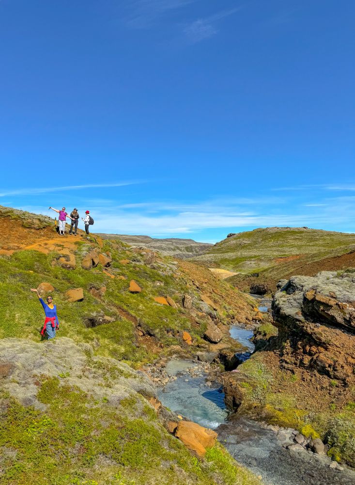 Picture of friends hiking in a geothermal river valley in Iceland 