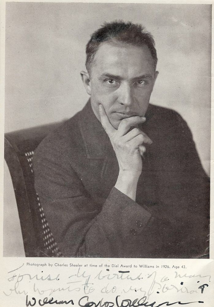 A B&W photo of Dr. Williams. He's holding his chin and giving the camera a stare.