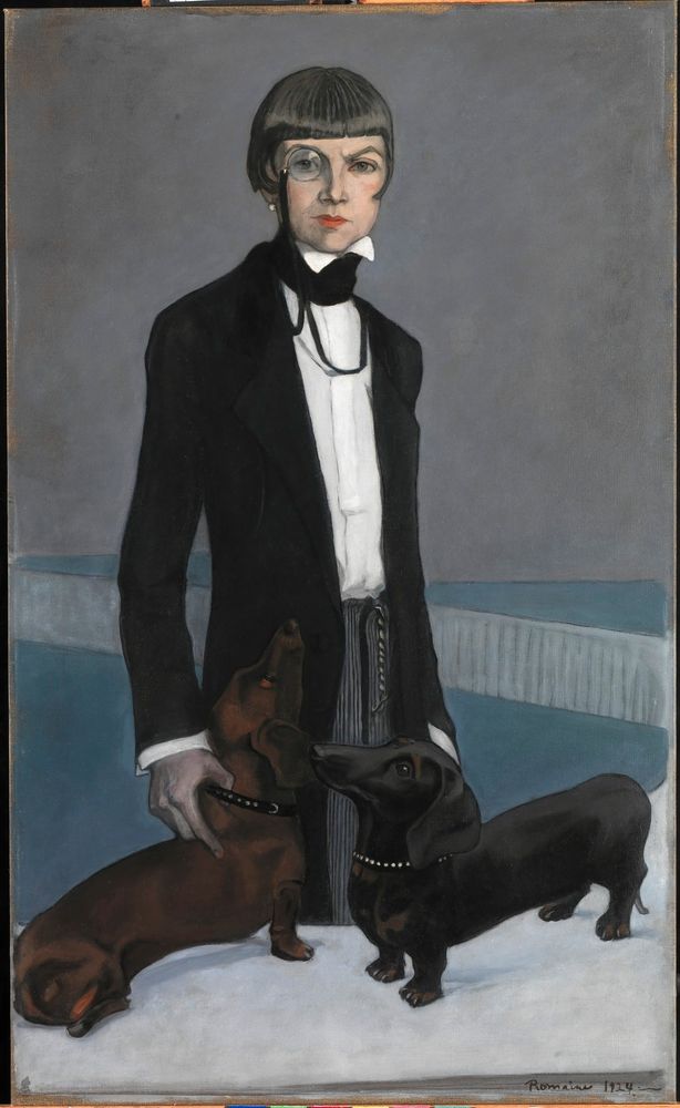 Portrait of a woman with a monocle she's wearing a black jacket and a white shirt with a high-wing collar sort of black wrapped around her neck there are two dachshunds beside her