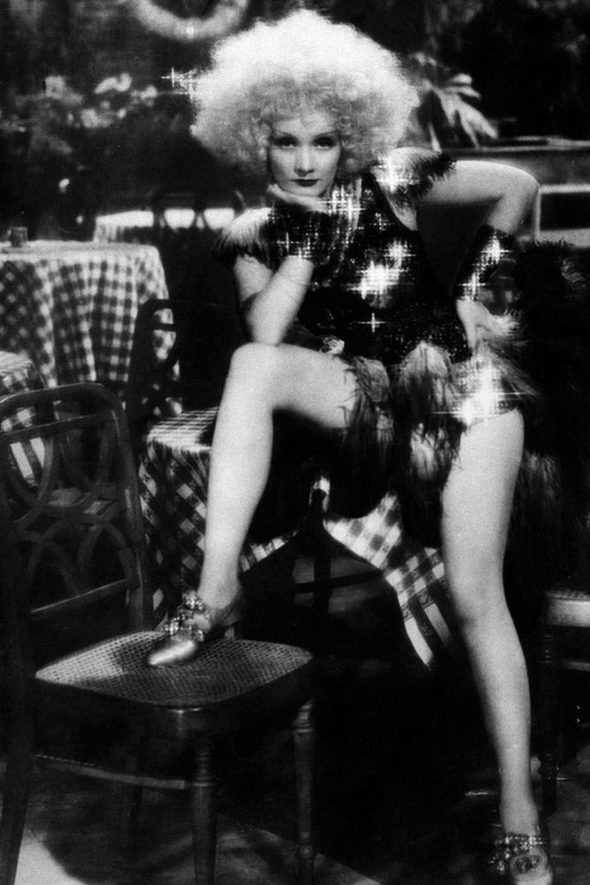 Dietrich in a shiny sort of dress and a huge blonde wig and what I think is promotional shot for Blonde Venus she's this is the outfit she wears after she gets out of her gorilla costume in the amazing and quite racist jungle dance nightclub scene 