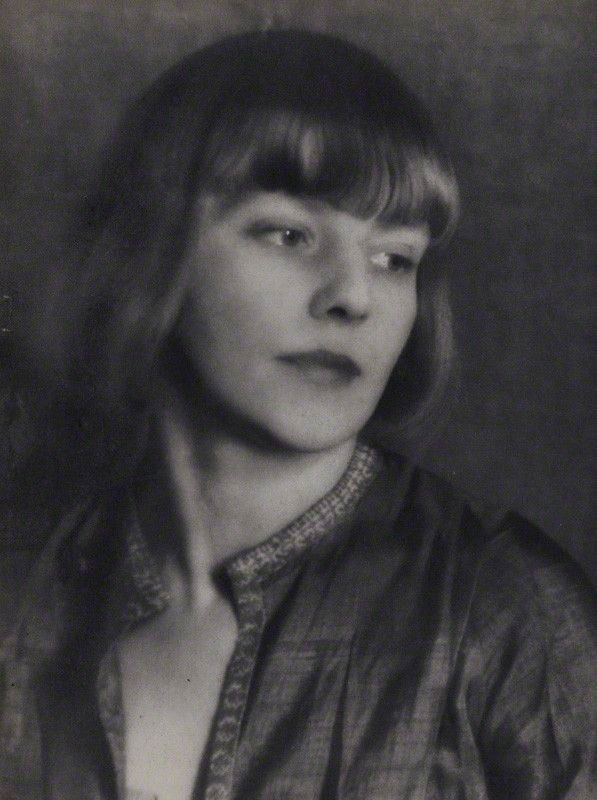 Black and white photograph of the poet and actress Iris tree looking really lovely a close up just to her head and shoulders
