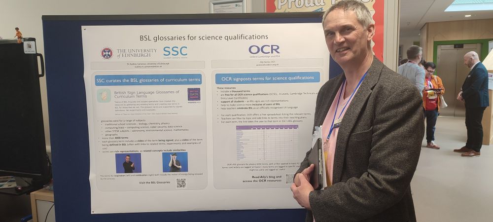 Photo of me standing with my poster