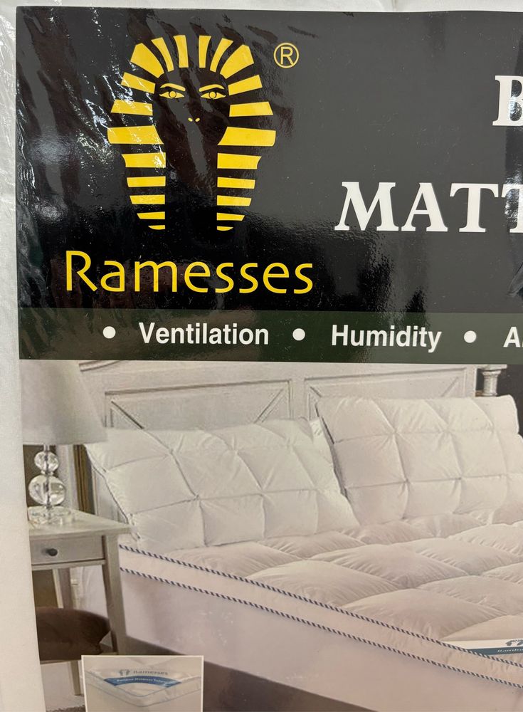 A photo of product packaging for a mattress cover bearing the name Ramesses