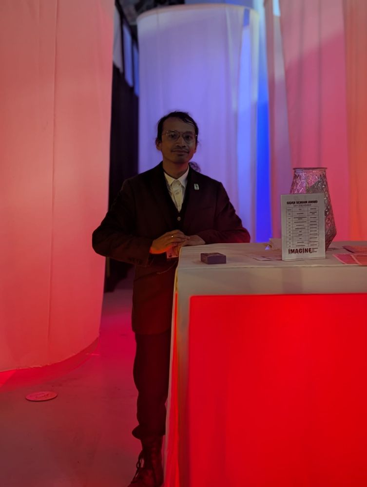 me in a 3 piece suit as VR-HOST and curator 