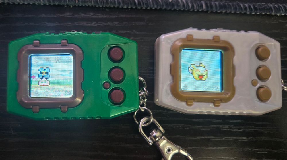 Two Digimon Pendulum Colors. Left is Wind Guardians and right is Virus Busters. 