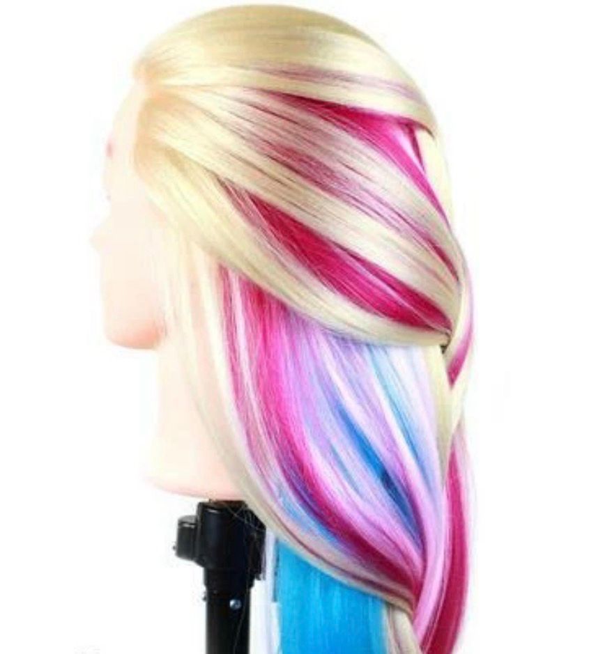 A cosmetology head with long multi colored hair 