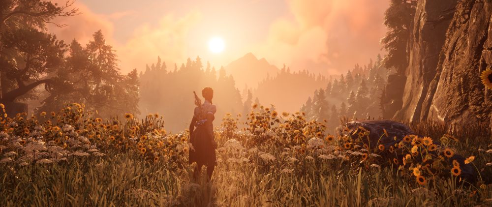 A screenshot of Chapter 9 of the game South of Midnight. The main character, Hazel, is looking at the setting sun while standing in a field of flowers overlooking a cliff.