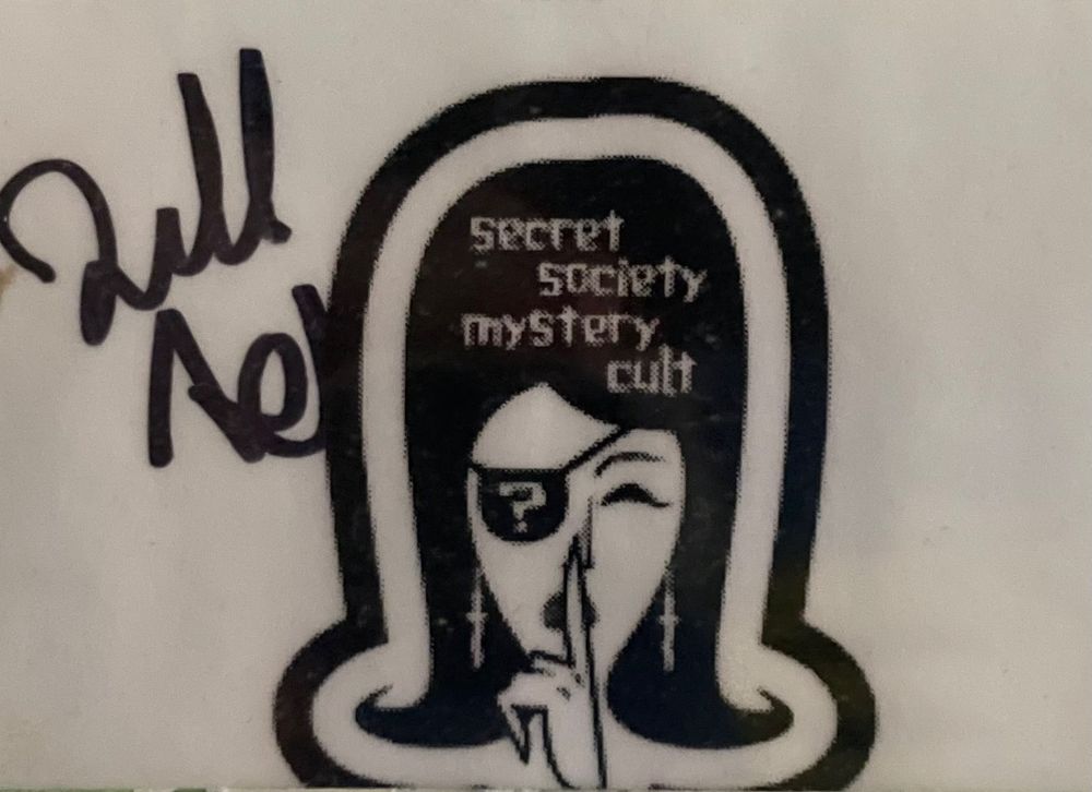 Illustration of woman with eye patch and finger on lips with words Secret Society Mystery Cult