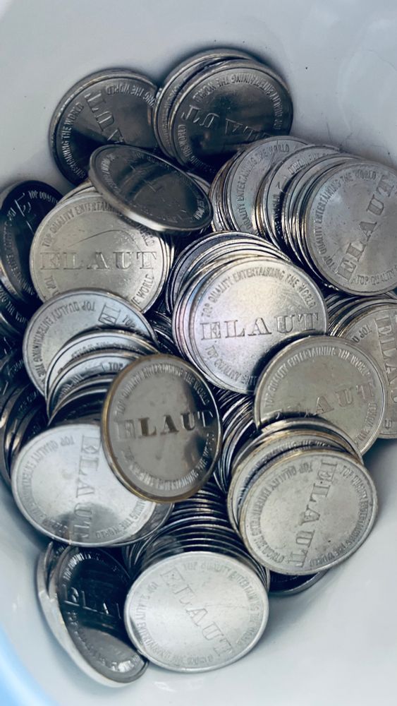 A pile of arcade tokens. 