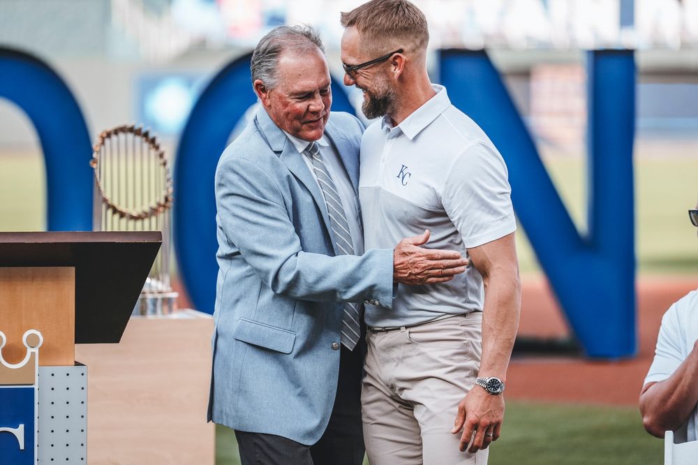 Alex Gordon hugs his former manager and fellow Royals Hall of Fame member Ned Yost.