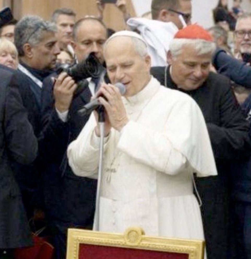 The Pope looking like he's rapping into a microphone "