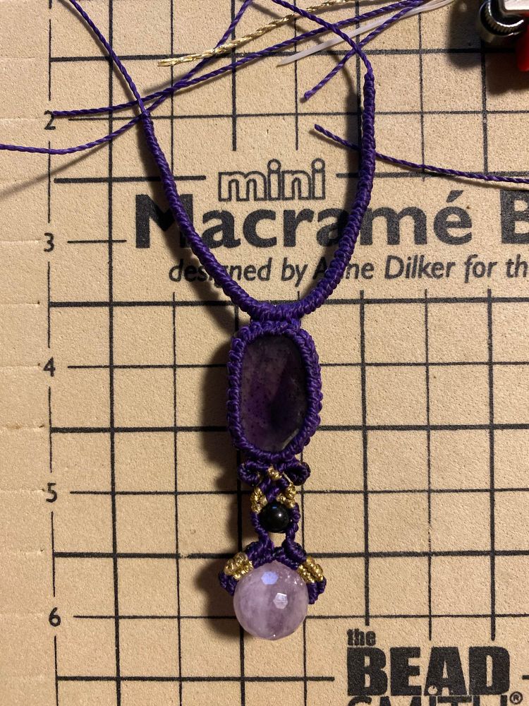 Amethyst and obsidian necklace made with purple and gold cord
