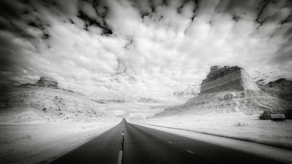 Black and white images of a highway along the Oregon Trail in Nebraska.

Most Native Americans tolerated wagon trains passing through their territories. Many pioneers would not have made it if it had not been for trading with the tribes along the trail. There were conflicts between Native Americans and emigrants along the trail, but, when compared to the number of people traveling the Oregon Trail, deaths by Indians attacks were very rare.

Emigrants on the Oregon Trail suffered tremendous hardships. Death was an ever-present companion. It is estimated that as many as 1 in 10 emigrants died on the trail—between 20,000 and 30,000 people.

The majority of deaths occurred because of diseases caused by poor sanitation. Cholera and typhoid fever were the biggest killers on the trail. Another major cause of death was falling off of a wagon and getting run over. This was not just the case for children; many adults also died from this type of accident.

The idea of crossing "the great American desert" and the perceived dangers caused many people who were not hunters or soldiers to purchase firearms, many for the first time, which they were not used to handling. Mishaps with firearms caused many injuries and deaths.


During eight decades in the 1800s the Oregon Trail served as a natural corridor as the United States grew from the eastern half of the continent toward the west coast. The Oregon Trail ran approximately 2,000 miles west from Missouri toward the Rocky Mountains and ended in Oregon's Willamette Valley. The California Trail branched off in southern Idaho and brought miners to the gold fields of Sierra Nevada. The Mormon Trail paralleled much of the Oregon Trail, connecting Council Bluffs to Salt Lake City.

National Historic Oregon Trail Interpretive Center

Scottsbluff, NE