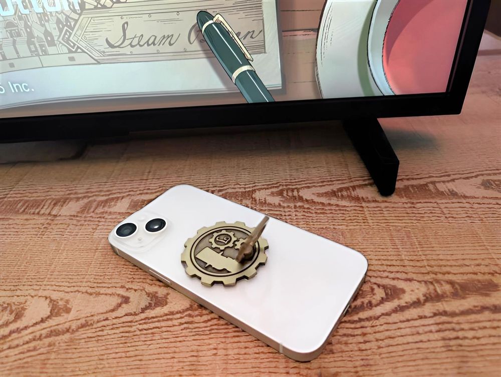 A Professor Layton themed phone stand attached to the back of a phone.