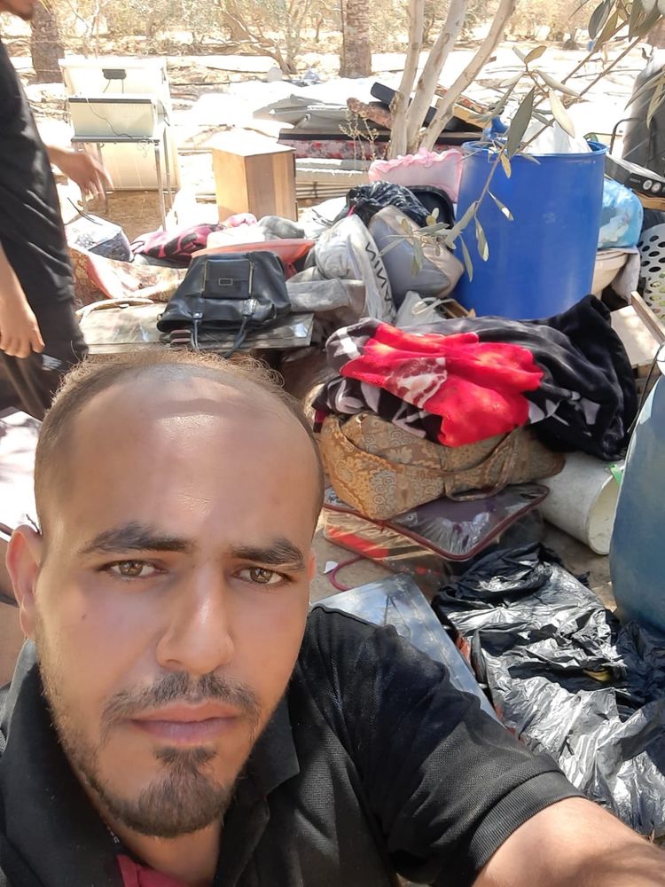 Baha selfie in front of the family’s things.