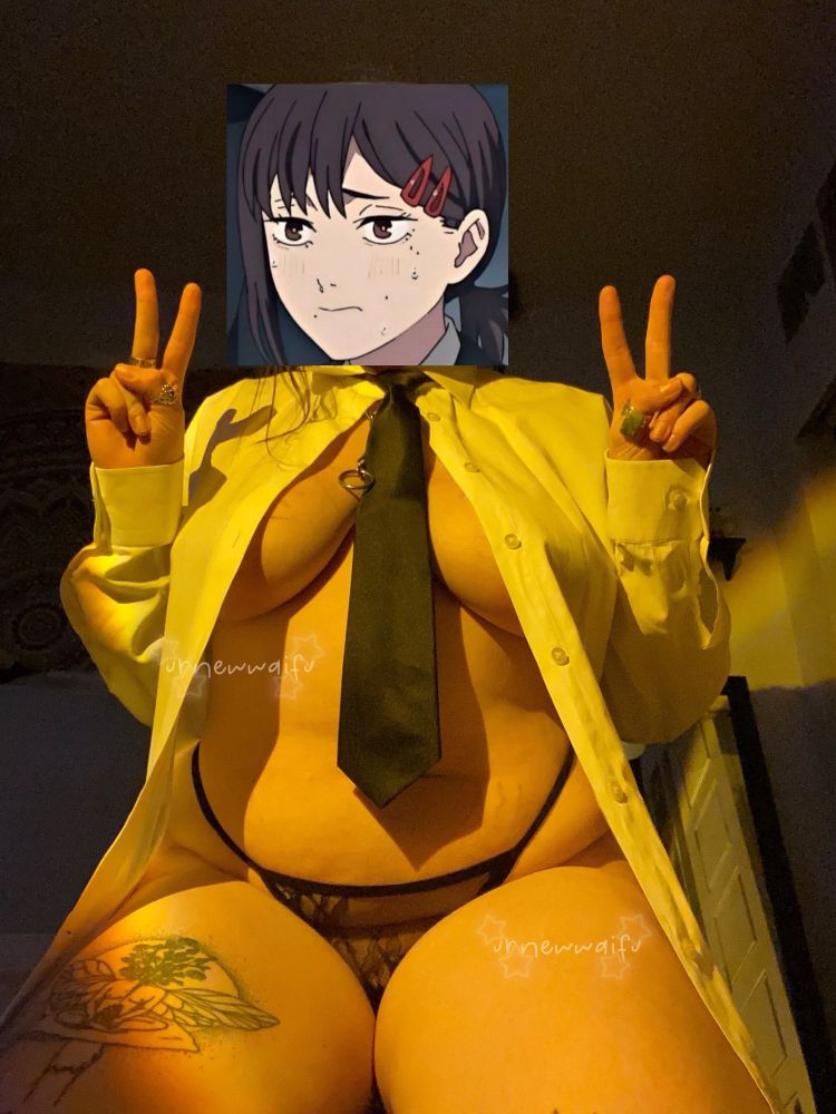 picture of picture sitting on the floor on their knees. theyre wearing a kobeni (chainsaw man character) cosplay. they are wearing a lacey black thong, a white long sleeved button up thats unbuttoned and a black tie. their hands are forming peace signs on either side and their face is covered with a picture of kobeni from the show.