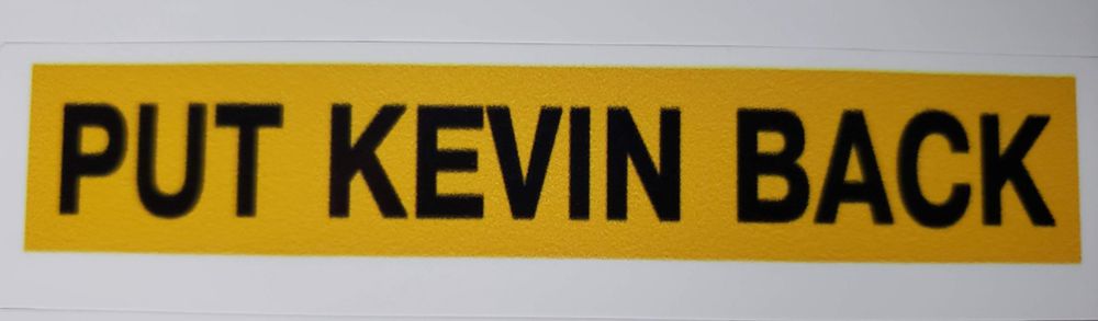 yellow sticker that says “put kevin back”