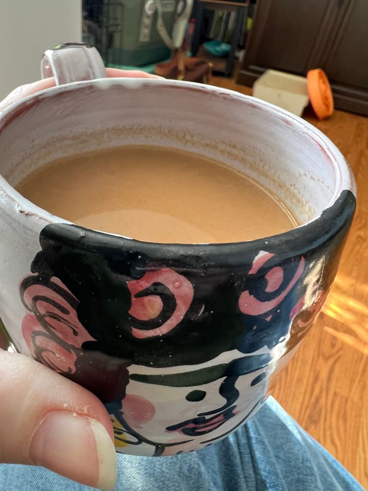 A handmade mug filled with chai