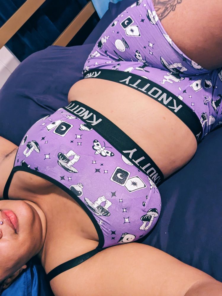 A picture of my sumptuously curvy torso wearing tarot themed bralette and boxer set.